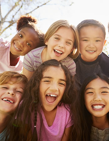 Children with big smiles on their faces